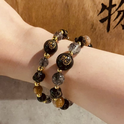黑曜石。黑金太陽。黑髮晶。達摩雕刻